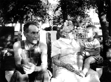 Pre-school girl sitting in oversized Adirondak chair in the backyard of her grandparents.